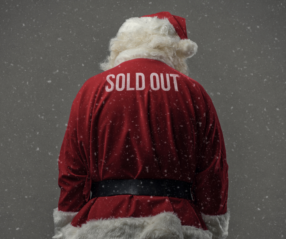 Back of Santa with head down and SOLD OUT printed on the back of his suit