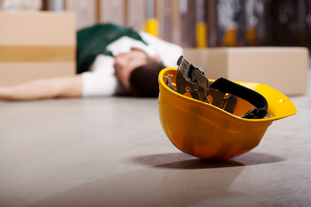 Dangerous accident in warehouse during work - wounded worker
