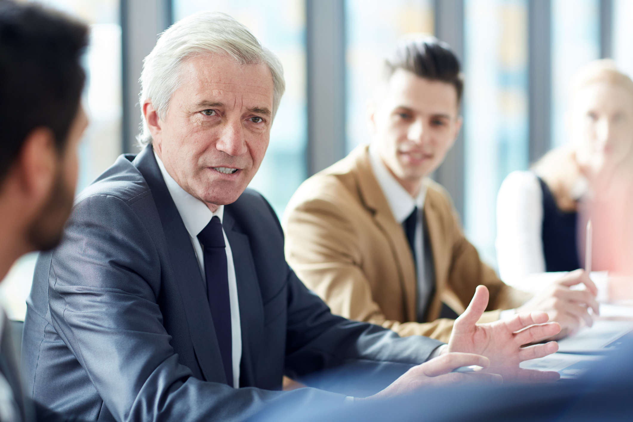Businessman meeting with team