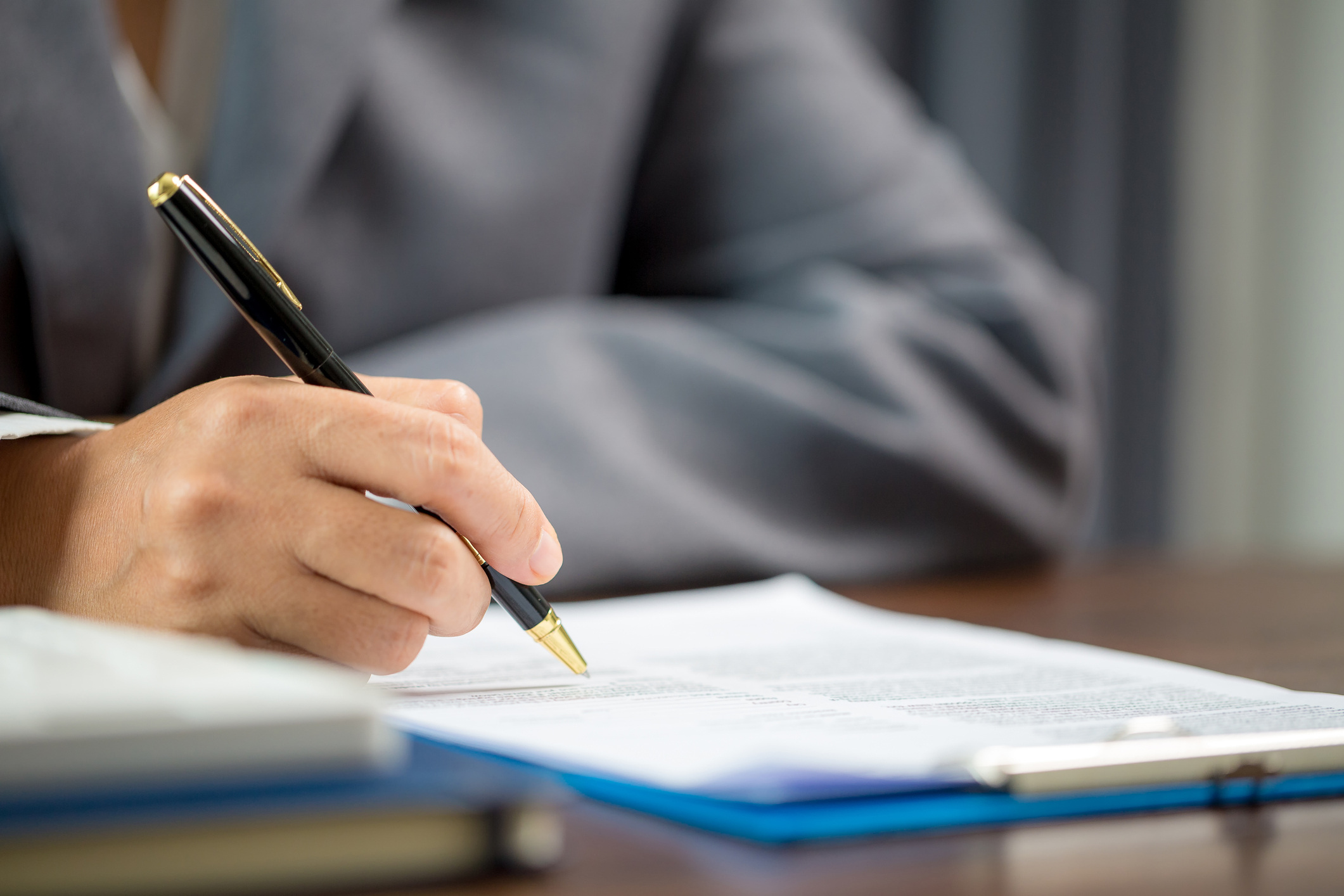 Woman signing document